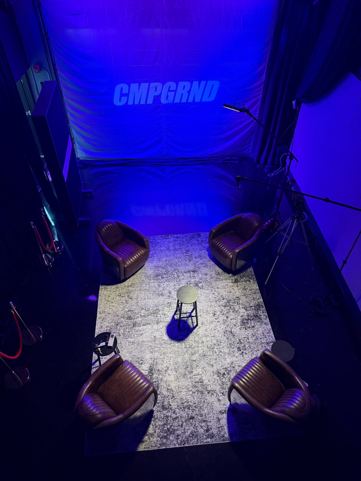 Lounge and shoot floor at the RMP LLC studio under blue stage light